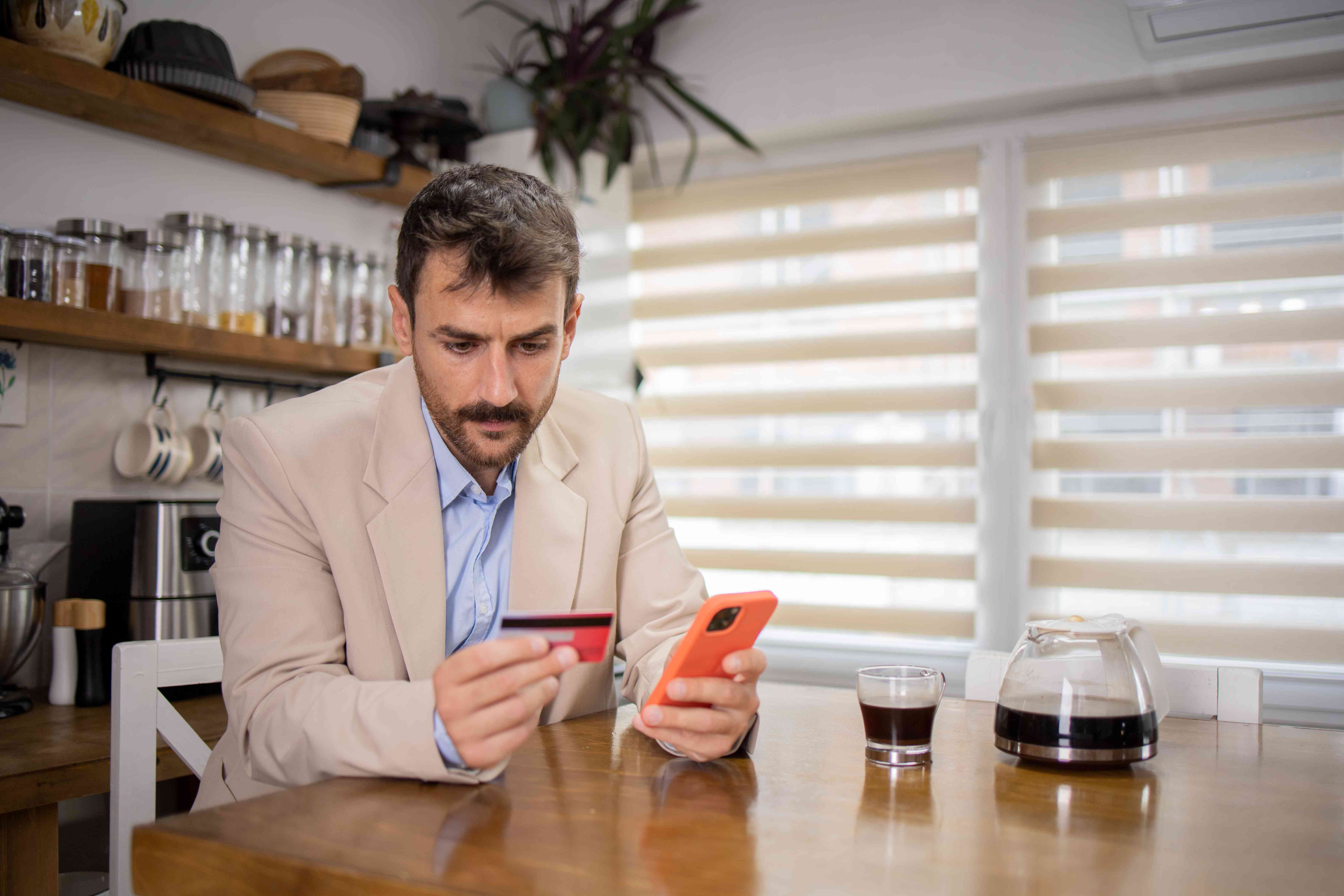 Man checking out his prepaid card options