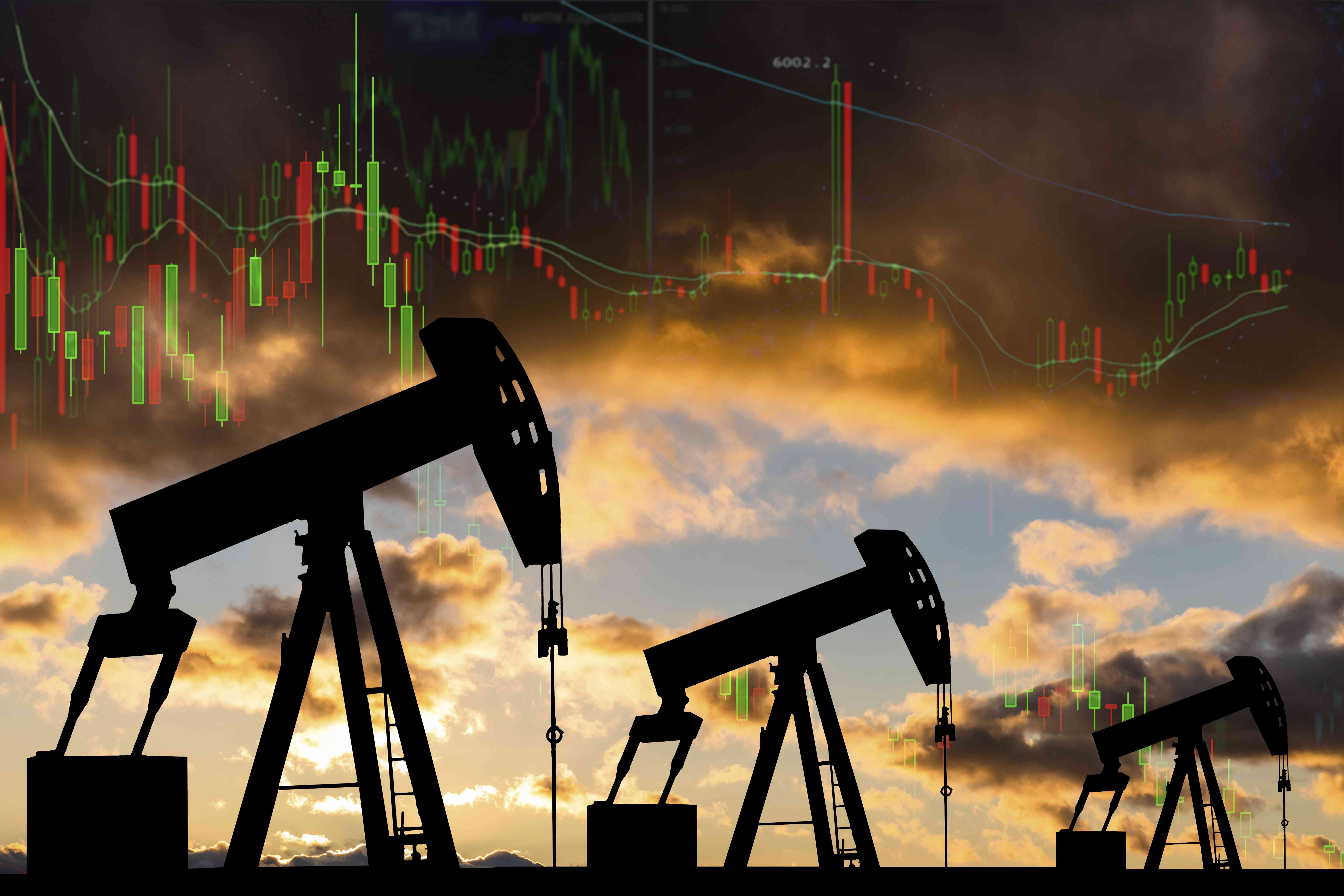 Oil pumps against a background of a candle stick chart