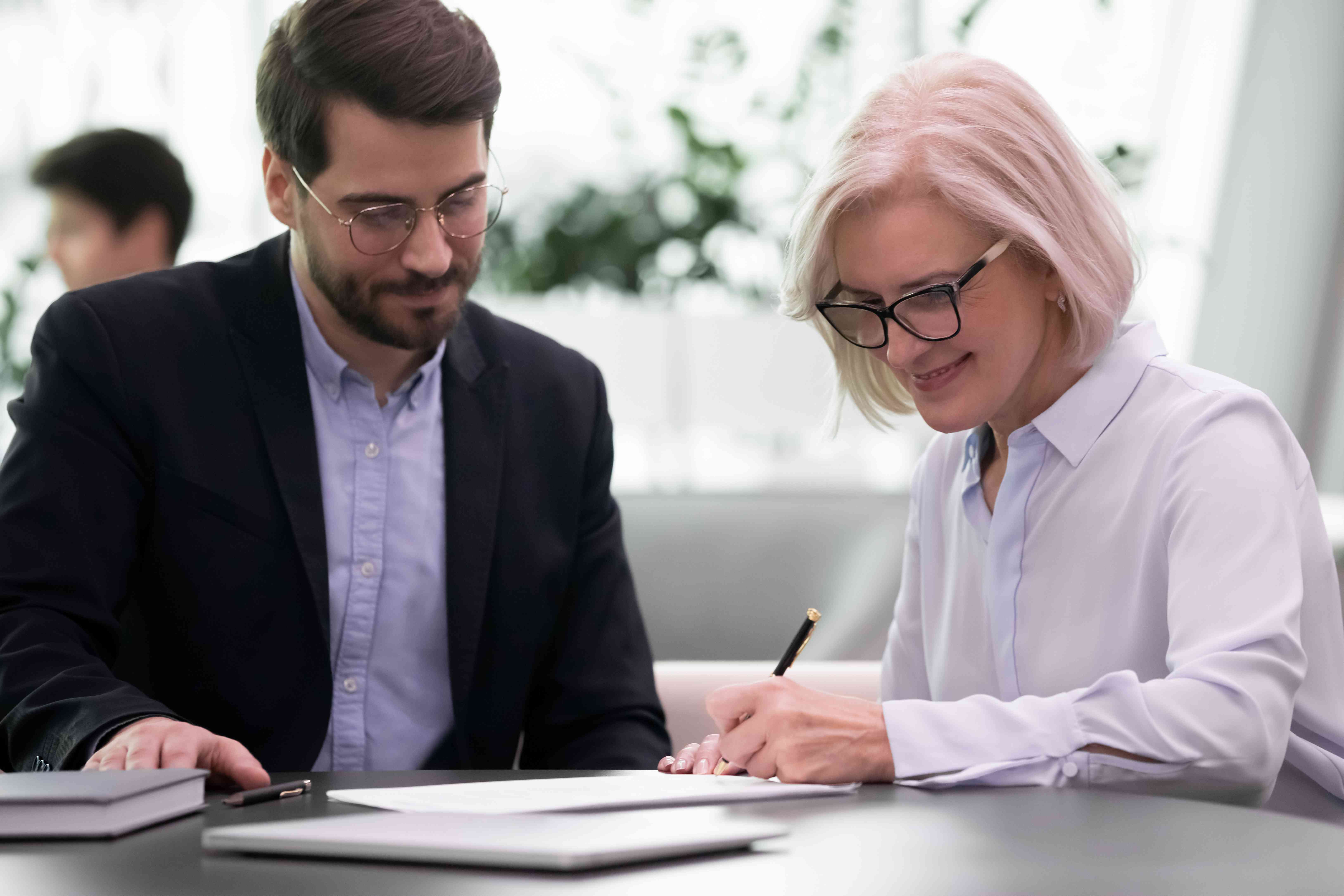 Woman signing paper