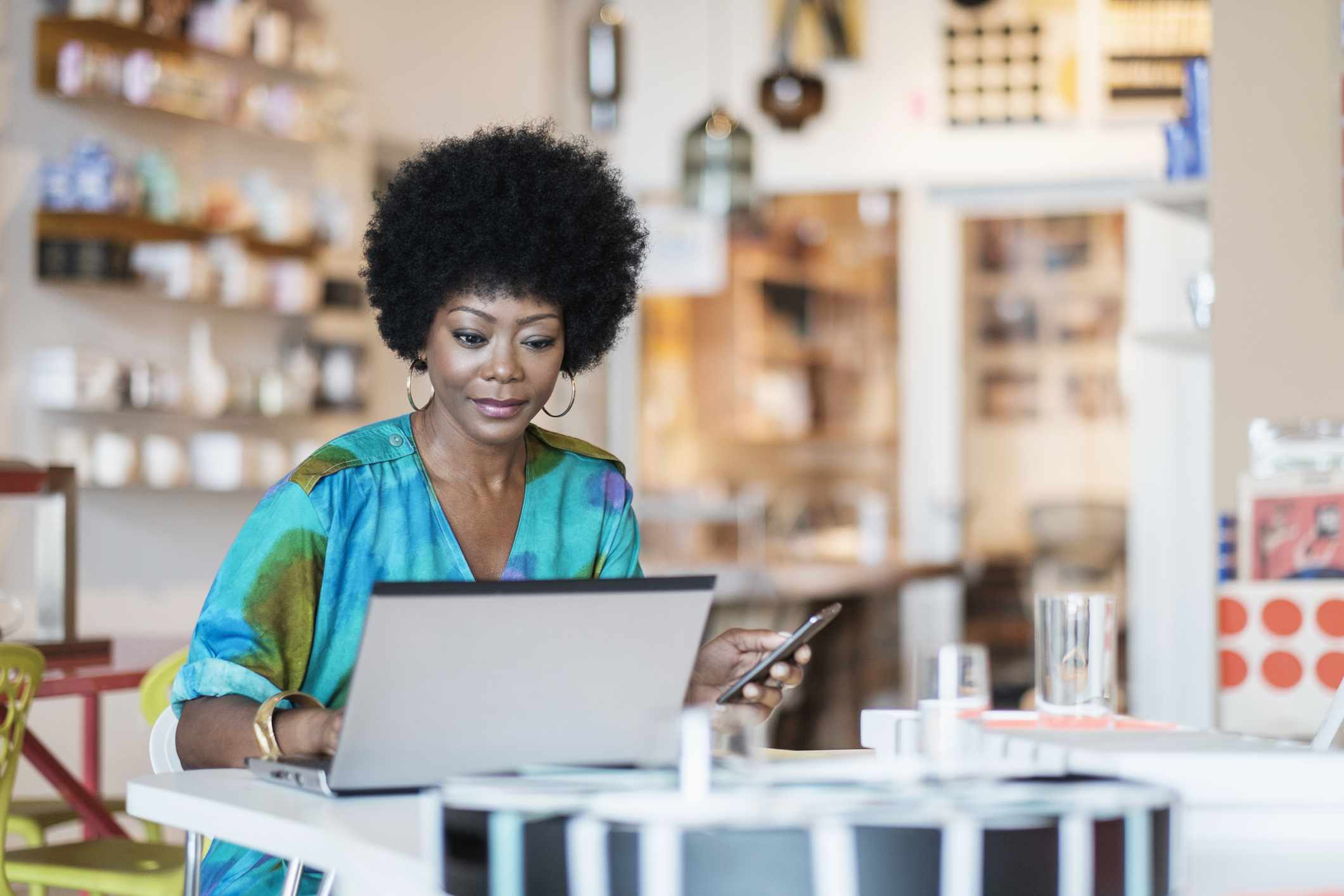 A business owner looks at a computer.