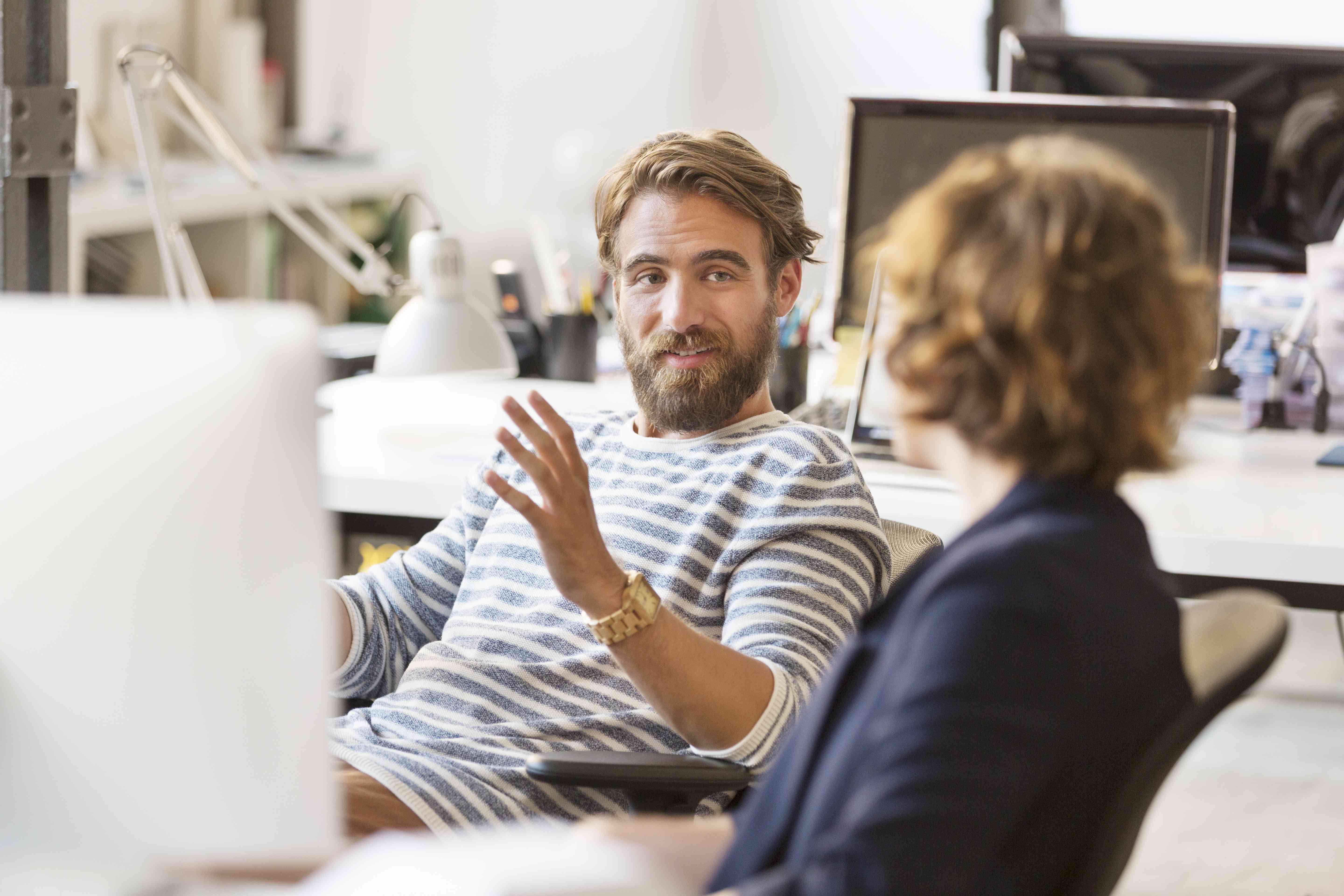 Two people engage in a discussion.