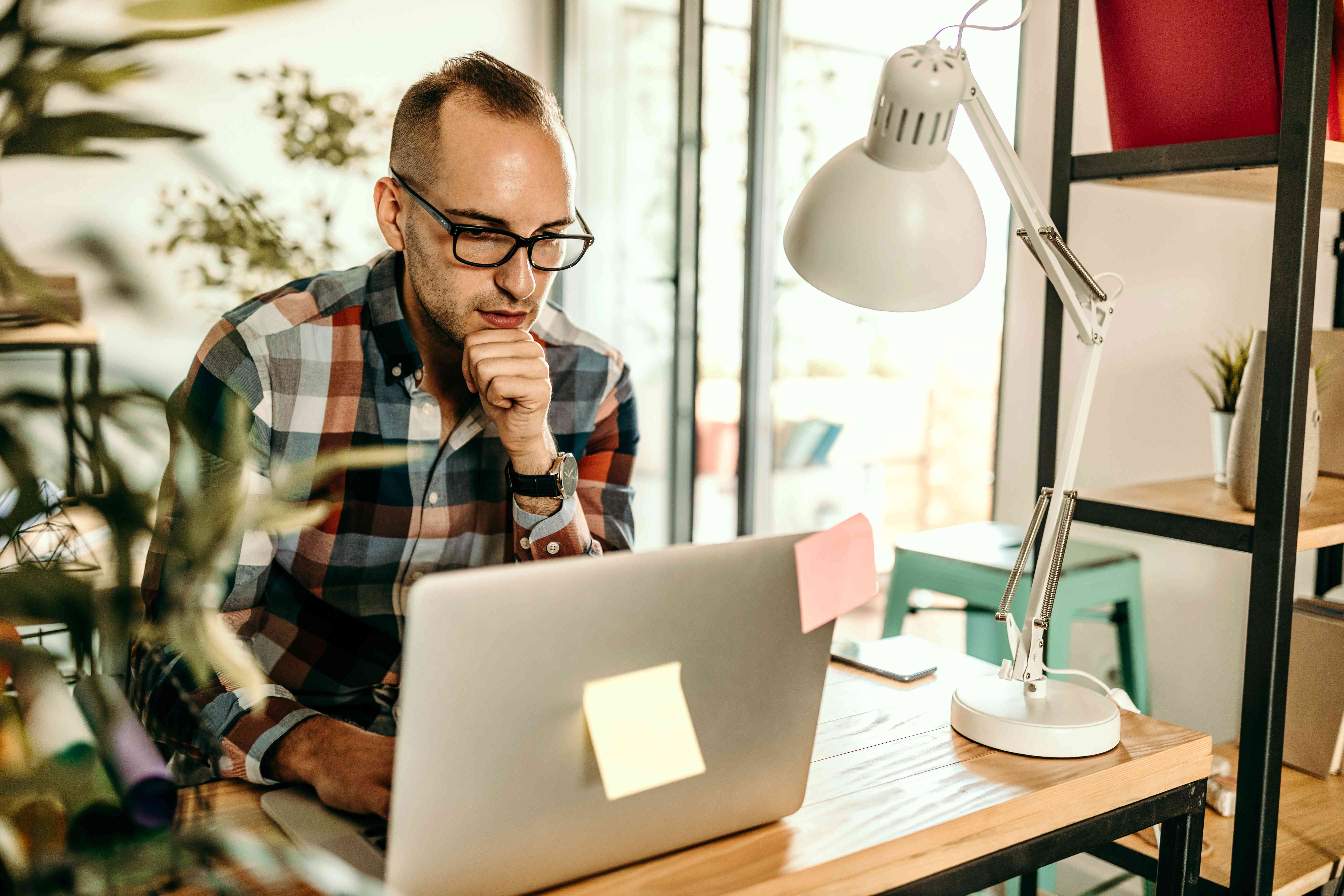 Man using his laptop to read information on the internet